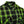 A close-up of a green and black plaid button-down shirt on a white background, featuring a chest pocket with a visible 'CROSS BEND SHIRT' label and sunglasses resting in the pocket.