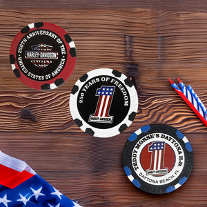 Three Harley-Davidson-themed poker chips on a wooden surface with an American flag.