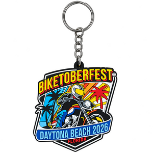 A BIKETOBERFEST 2026 Daytona Beach Florida keychain featuring a colorful graphic of a skeleton riding a motorcycle with palm trees and a sunset, attached to a silver metal split ring and chain.