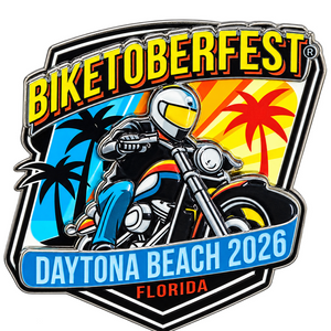 A die-cut enamel pin or sticker featuring a stylized biker on a motorcycle with the text 'BIKETOBERFEST' and 'DAYTONA BEACH 2026 FLORIDA' on a white background.
