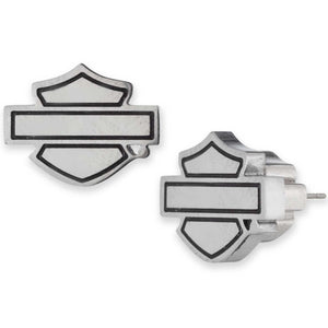 Pair of silver earrings with a shield design on a white background