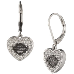 A pair of silver leverback earrings featuring a heart-shaped dangle paved with clear rhinestones, with a central black Harley-Davidson logo bar, shown on a plain white background.