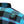 Close-up of a plaid button-up shirt in black, teal, and purple, featuring a circular embroidered skull patch on the chest.