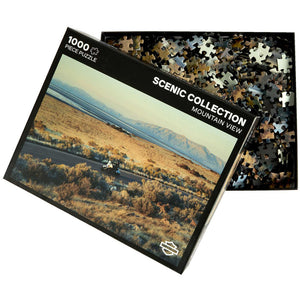 Jigsaw puzzle packaging with scenic landscape design and 'Scenic Collection' text.