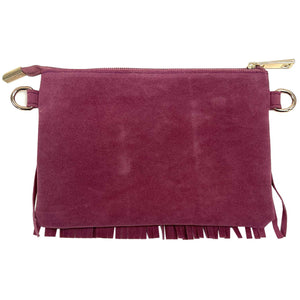 Pink suede clutch bag with gold accents on a white background