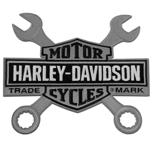 A Harley-Davidson embroidered patch featuring crossed wrenches and a central shield with the words 'MOTOR HARLEY-DAVIDSON TRADE CYCLES MARK'.