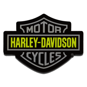 A Harley-Davidson Motor Cycles shield-shaped patch or emblem in black with gray lettering and a bright yellow horizontal band reading HARLEY-DAVIDSON, shown on a plain white background.