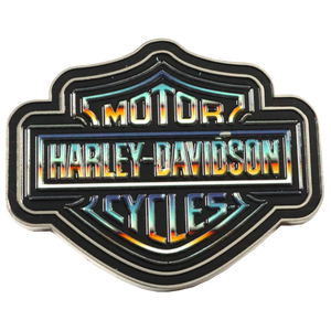 A Harley-Davidson Motor Cycles shield-shaped emblem with a black background and a holographic, iridescent blue and orange flame-embossed finish, isolated on a white background.