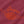 Close-up of a maroon fabric with 'Dickies' and 'Harley Davidson' logos.