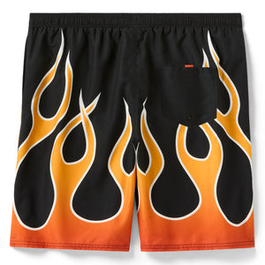 Black swim shorts with orange and white flame pattern on a white background