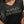 Black Harley-Davidson t-shirt worn by a person with a blurred background