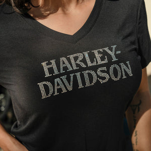 Black Harley-Davidson t-shirt worn by a person with a blurred background
