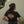 Person wearing a black Harley-Davidson t-shirt with a logo on the back.