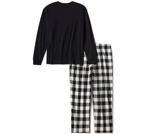 Black long-sleeve top and black and white checkered pants on a white background