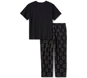Black t-shirt and black pants with skull pattern on a white background