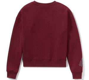 Maroon sweatshirt with floral embroidery on sleeve against a white background
