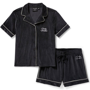 Black pinstripe pajama set with white trim on a white background