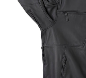 Close-up of a black jacket with zippers and pockets on a white background