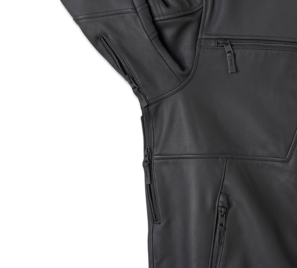 Close-up of a black jacket with zippers and pockets on a white background