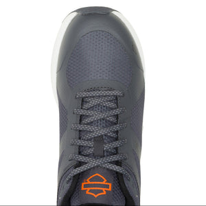 Gray athletic shoe with orange logo on a white background