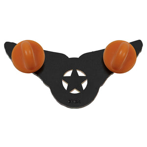 A black plastic bowfishing arrow nock with two orange rubber nocks, featuring a star-shaped cutout in the center and the brand name 'DEKA' embossed near the base.