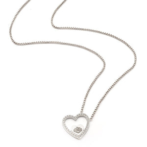 Silver necklace with a heart-shaped pendant on a white background