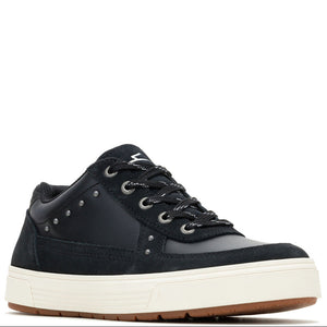 A low-top sneaker in black suede and smooth synthetic fabric, featuring black laces, silver metal eyelets, and a thick off-white platform sole with a brown outsole, shown against a plain white background.