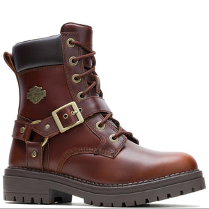 A brown leather motorcycle-style boot with a dark brown collar, lace-up front, decorative buckle strap, and a brass-tone Harley-Davidson logo patch on the side, shown against a plain white background.