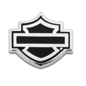 A Harley-Davidson bar and shield emblem badge, featuring a polished silver-tone metal border with black enamel fill, centered on a plain white background.