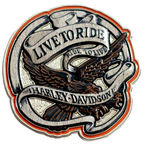 A circular Harley-Davidson Live to Ride metal pin or badge featuring an eagle with spread wings, banners reading 'LIVETORIDE' and 'HARLEY-DAVIDSON', and a red-orange inner border on a plain white background.