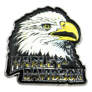 A Harley-Davidson eagle head enamel pin featuring a white and black eagle with a yellow beak and the words 'HARLEY-DAVIDSON' in black outlined lettering, shown on a plain white background.