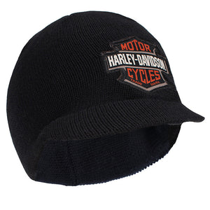 A black ribbed knit beanie hat featuring a prominent Harley-Davidson Motor Cycles logo patch on the front, set against a plain white background.