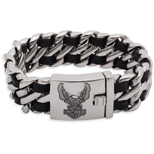 A silver-toned metal Cuban link bracelet with alternating black inlay segments and a rectangular clasp engraved with an eagle logo and the Harley-Davidson Motor Cycles brand name.