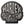 A Harley-Davidson skull-shaped metal emblem or badge in black and silver, centered on a plain white background.