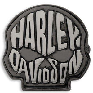 A Harley-Davidson skull-shaped metal emblem or badge in black and silver, centered on a plain white background.