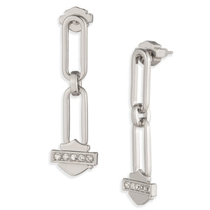 A pair of silver-toned drop earrings with elongated rectangular links, a small horizontal row of clear stones, and a shield-shaped charm, shown on a plain white background.