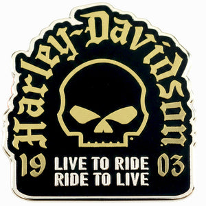 A Harley-Davidson enamel pin featuring a black background with gold and white details, including the brand name in gothic lettering, a skull graphic, and the phrases '19' and '03' with 'LIVE TO RIDE RIDE TO LIVE' below.
