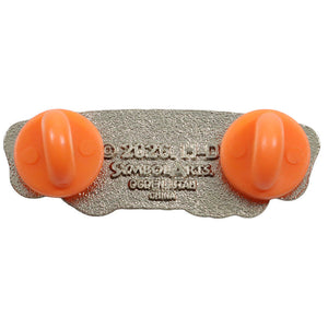 A vintage collectible pin from Sombrero Hats, featuring two bright orange plastic dome shapes mounted on a textured silver-tone metal backing plate with embossed brand text.