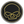 A circular black car emblem featuring a stylized yellow skull graphic, surrounded by a silver metallic border, shown on a plain white background.