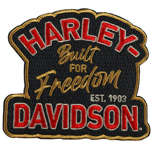 An embroidered patch featuring the Harley-Davidson logo and slogan 'Built for Freedom' with 'EST. 1903' on a black background with red and gold lettering.
