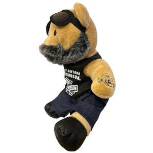 Plush bear toy with goggles, black tank top, and navy pants on a white background
