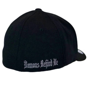 Black cap with 'Demons Behind Me' text on a white background