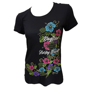 A black short-sleeve crewneck t-shirt featuring a colorful graphic print of hibiscus flowers and the words 'Daytona Harley-Davidson' on the front, displayed on a white background.