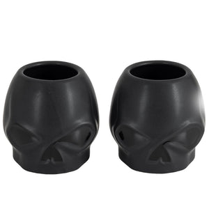 Two matte black skull-shaped cup holders or planters shown side by side on a plain white background.