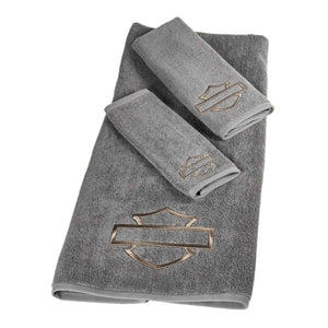 Set of three gray towels with a logo on a white background
