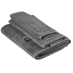 Folded gray towel with a logo on a white background