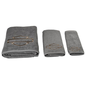 Set of three gray towels with a logo on a white background