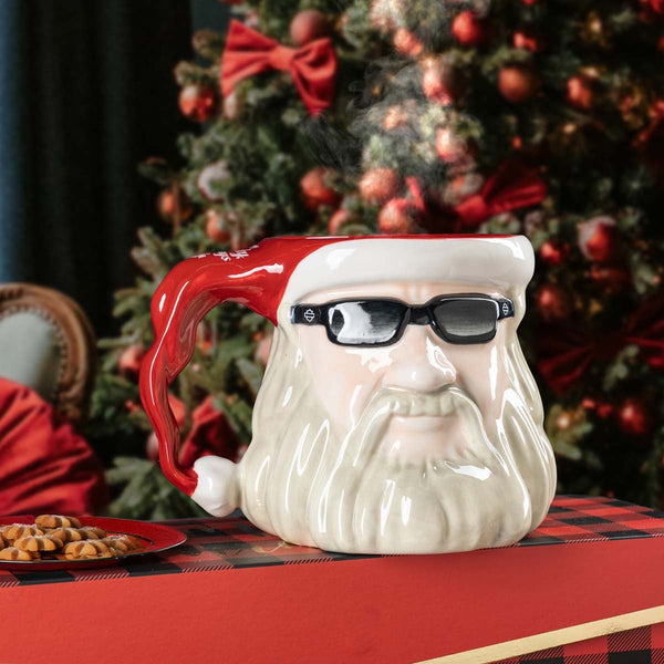 Santa Claus mug with a Christmas tree in the background