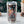Clear tumbler with a design of Santa Claus on a motorcycle, surrounded by gifts, against a Christmas-themed background.