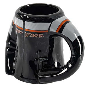 A glossy black ceramic mug shaped like a Harley-Davidson motorcycle helmet, featuring the brand name in brown and white stripes with orange accents on a white background.